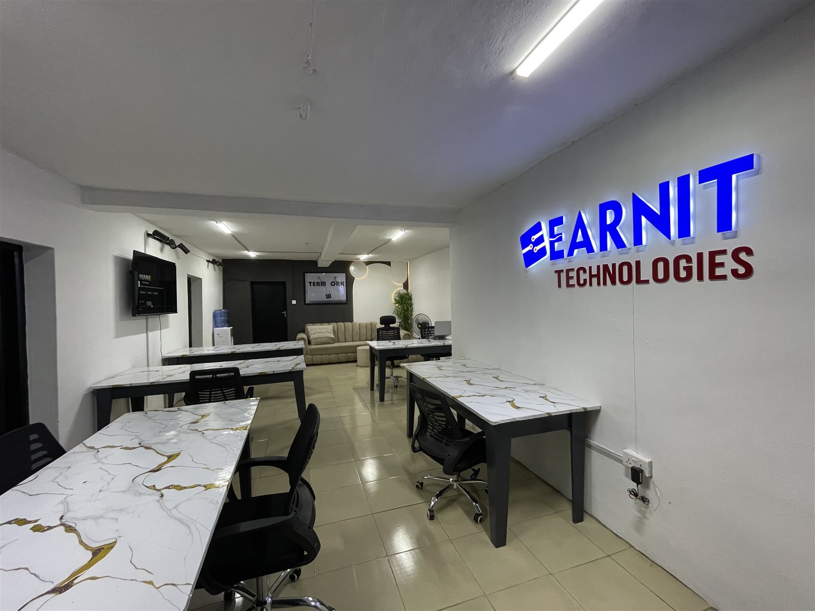 Shared desks and office seating inside EarnIT Hub in Ibadan